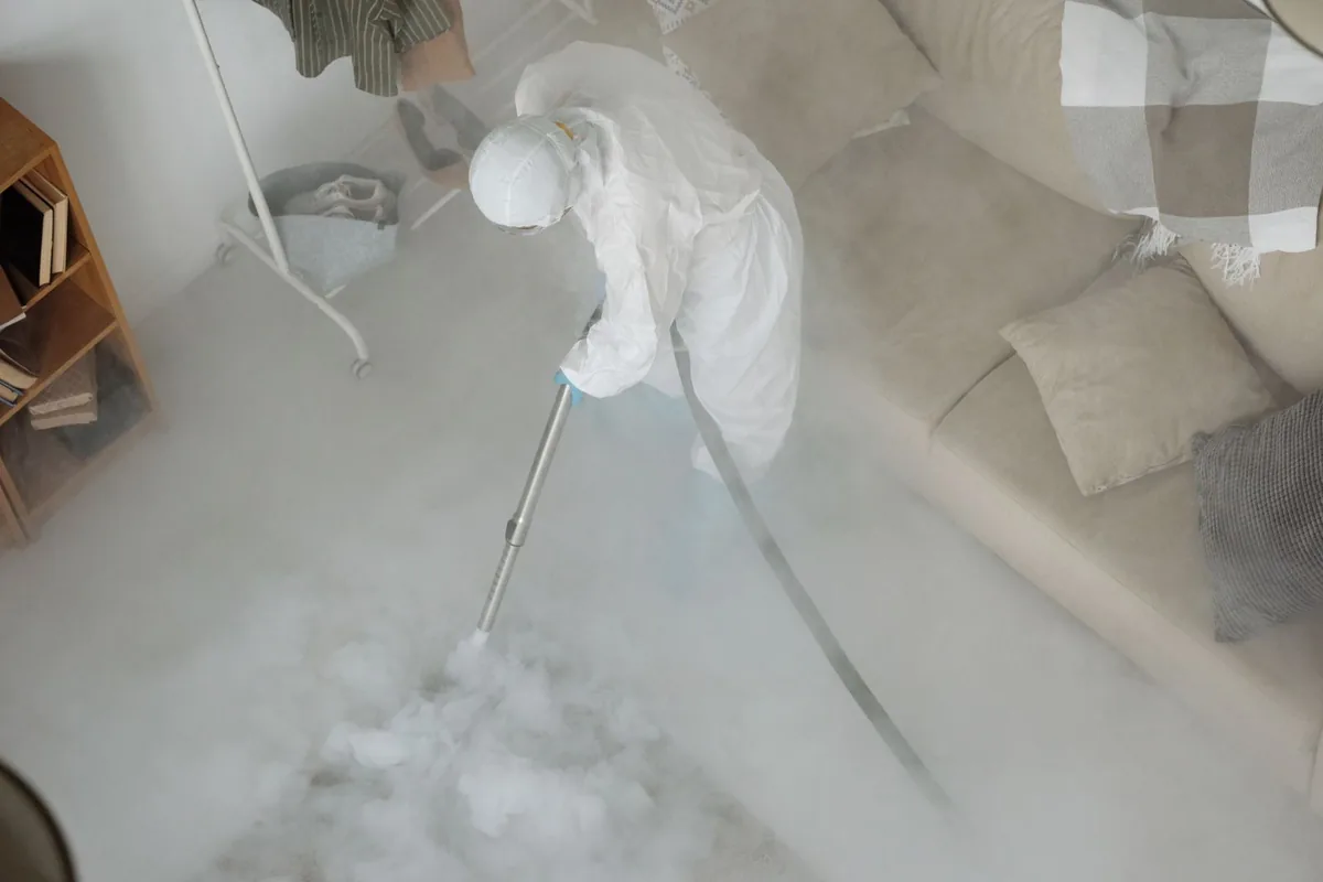Biohazard cleanup technician in protective equipment, Homer, NY